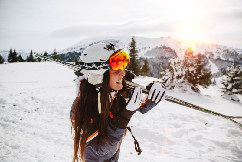 A young female skier walks to a chair lift at Leavenworth Ski Hill.