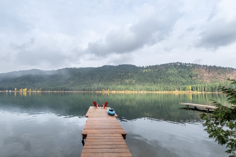 Fishing Cabins on the Water: A beautiful lakeside vista from a dock.