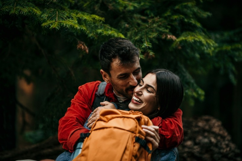 Leavenworth Romantic Getaways: A romantic couple embrace and share smiles while vacationing in Leavenworth, WA.